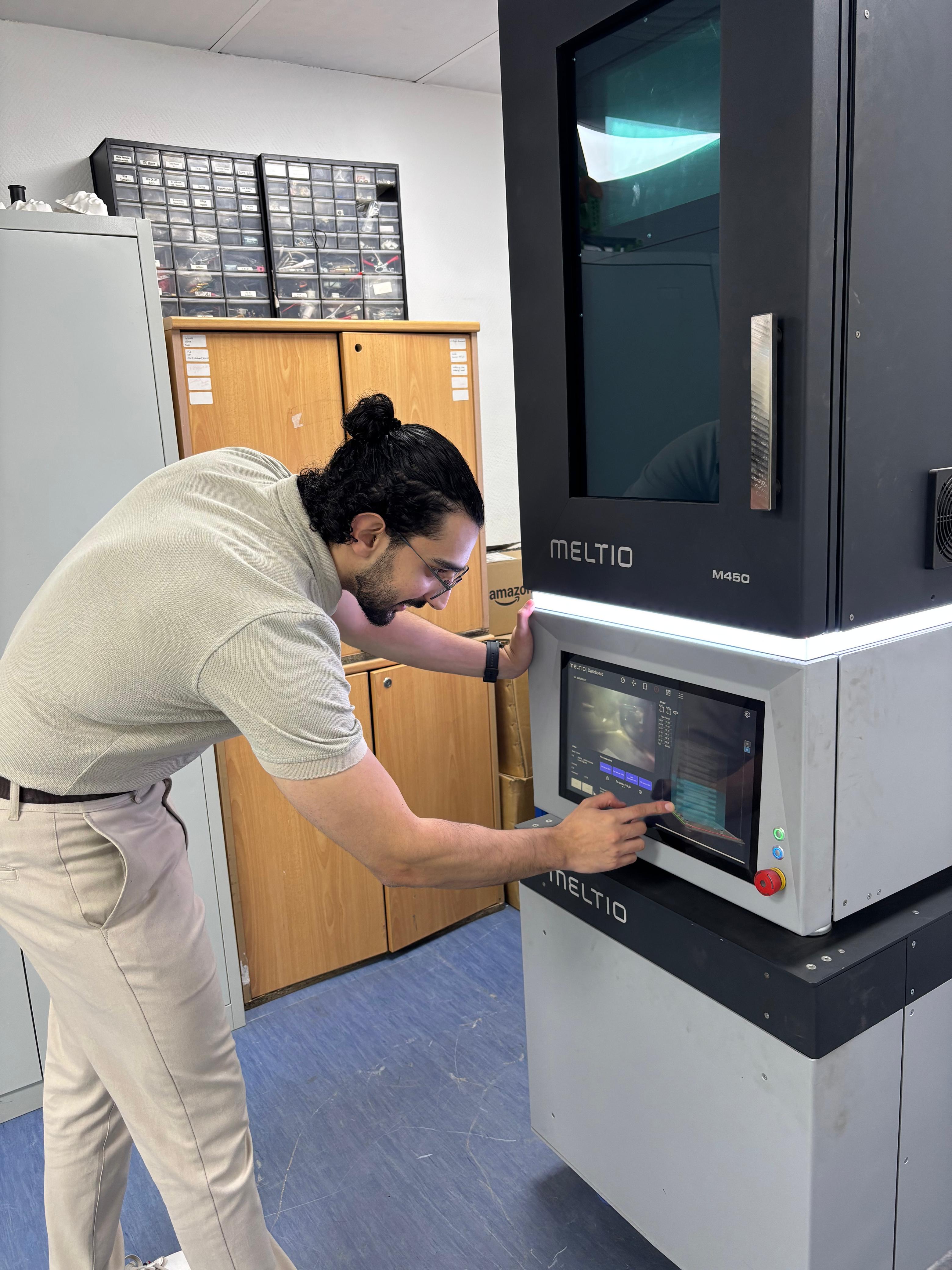 Ayman Ahdy at work with the Meltio wire laser metal deposition system at PRECISE, Dubai